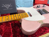 Vintage Fender Custom Shop Telecaster guitar in pink with maple neck, showing wear and finish relic, displayed in red plush case with Fender Custom Shop Custom Care booklet and owner's manual.