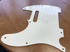 White guitar pickguard for Telecaster style electric guitar with screw holes and single pickup slot on wooden surface