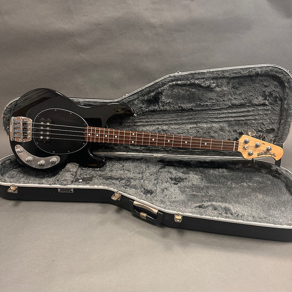 Black Music Man StingRay electric bass guitar with rosewood fretboard in open black plush-lined hard case