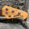 Ernie Ball Music Man StingRay bass guitar headstock with tuning pegs in guitar case with gray plush lining