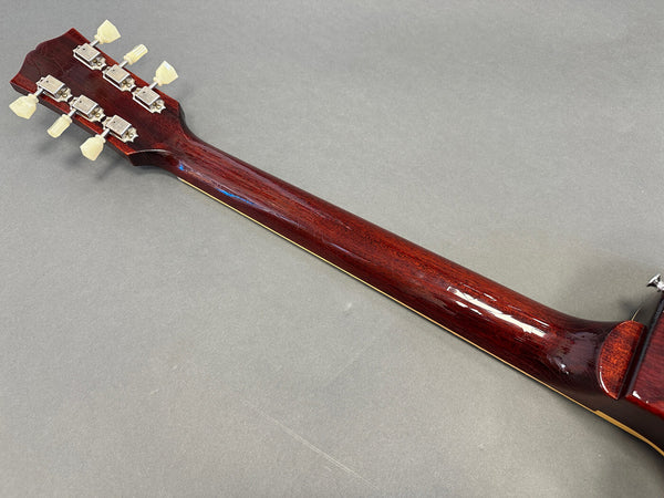 Back of vintage guitar neck with tuning pegs, glossy dark wood finish, and ivory tuning keys on gray background for Coffee House Guitars product listing