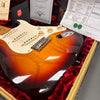 Sunburst Fender Stratocaster electric guitar in red plush lined case with warranty and certification papers
