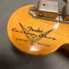Close-up of Fender Custom Shop Limited Edition logo on the back of a natural wood guitar headstock with vintage tuning pegs