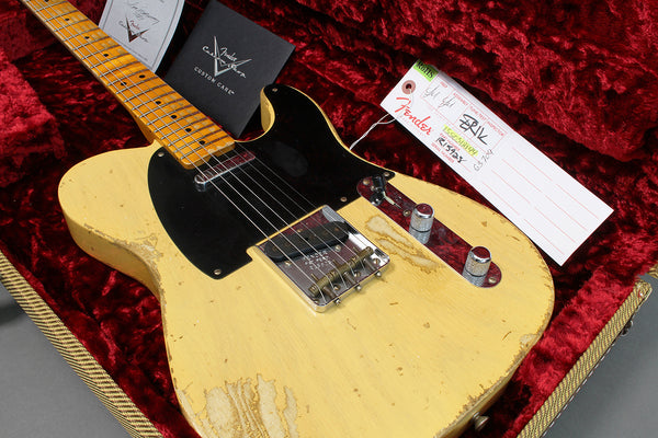 Vintage Fender Telecaster electric guitar with worn cream finish and black pickguard in red plush-lined hard case and Fender Custom Care booklet