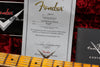 Fender Custom Shop certificate for 1951 Telecaster Relic with guitar neck on red plush background