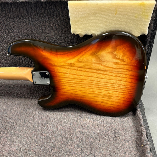 Sunburst electric guitar body back in hard case with neck plate and wood grain finish