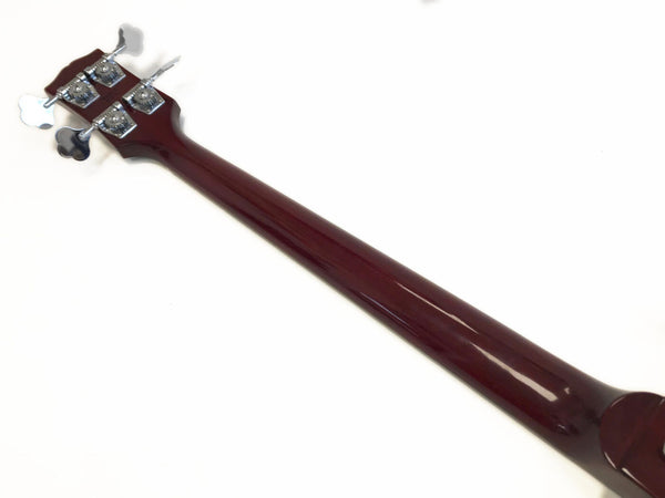 Back view of dark wood bass guitar neck with chrome tuning pegs on white background