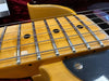 Close-up of vintage electric guitar maple fretboard with worn frets and steel strings on Coffee House Guitars listing