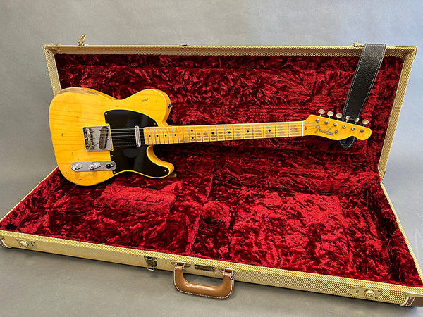Vintage Fender Telecaster electric guitar with maple fingerboard in open tweed case lined with red plush interior