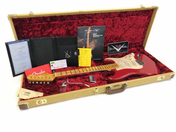 1963 Fender Custom Shop Stratocaster electric guitar in red with maple neck and fingerboard, displayed open in tweed hard case with red plush interior, with Fender certificate of authenticity, custom shop brochures, care card, and tremolo arm.