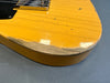 Close-up of worn yellow wood electric guitar body with visible paint wear and scratches on Coffee House Guitars product listing.