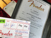 Fender Certificate of Authenticity for 1957 Stratocaster 1my Relic with serial number R91935 and Fender parts tag with serial number R91935, showing detailed handwritten assembly and inspection marks.