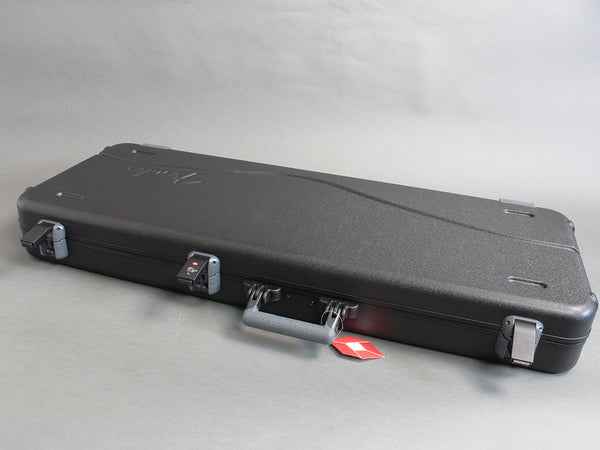 Black hard guitar case with metal latches and handle, designed for electric guitar protection and transport.
