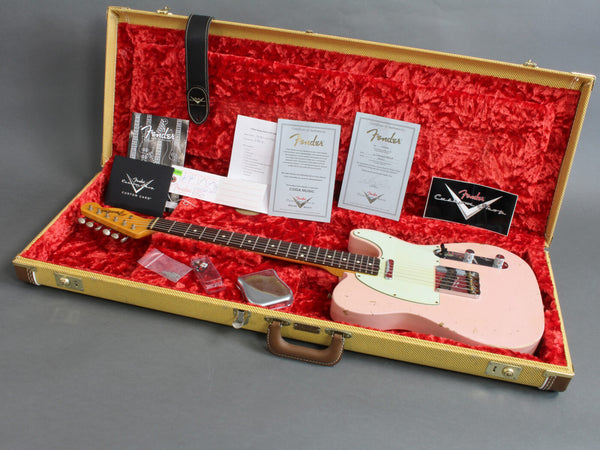 Fender vintage pink electric guitar in tweed hard case with red plush interior and Fender certificates and accessories