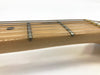Close-up of guitar neck and frets with steel strings on light wood fretboard, detailed view of string winding and fret markers against white background