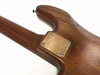 Close-up of wooden guitar neck joint with metal neck plate and screws on Coffee House Guitars electric guitar body