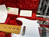 Fender '58 Tele Relic electric guitar in red sparkle finish with maple neck and vintage-style single-coil pickups, shown with owner's manual, Coffee House Guitars pre-sales checklist, and Fender quality control tags inside a red plush guitar case.
