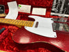 1968 Fender Telecaster electric guitar in red sparkle finish with white pickguard, maple neck and fretboard, displayed in red plush-lined case with owner's manual and Fender certification paperwork