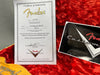 Fender Certificate of Authenticity for 58 Telecaster Relic Custom Shop guitar with signed endorsement and serial number R42370 on red plush case lining next to Fender Custom Shop logo sticker