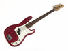 Red Fender Precision Bass guitar with white pickguard and rosewood fretboard on white background