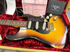 Fender Custom Shop vintage sunburst electric guitar with white pickups and tremolo arm in red velvet-lined case with Fender Custom Shop Custom Care paperwork