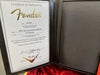 Fender Certificate of Authenticity for SRV Sig Stratocaster Relic guitar dated 9/20/19 with serial number CZ544024 in black leather certificate holder with red velvet guitar case lining