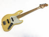 Vintage cream Fender Precision Bass with maple fretboard and white pickguard, four-string electric bass guitar on white background