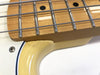 Close-up of maple fretboard with metal frets and four strings on white electric guitar body showing neck joint area with yellow tint and screw detail.