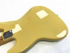 Glossy tan electric guitar body back with metal neck plate and four screws on white background
