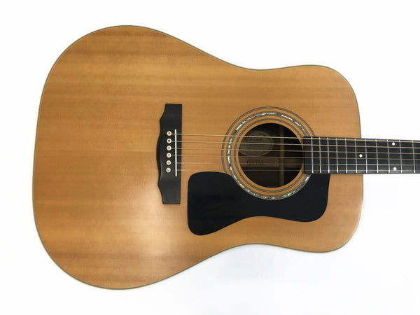 Natural wood finish acoustic guitar with black pickguard and six strings from Coffee House Guitars product listing