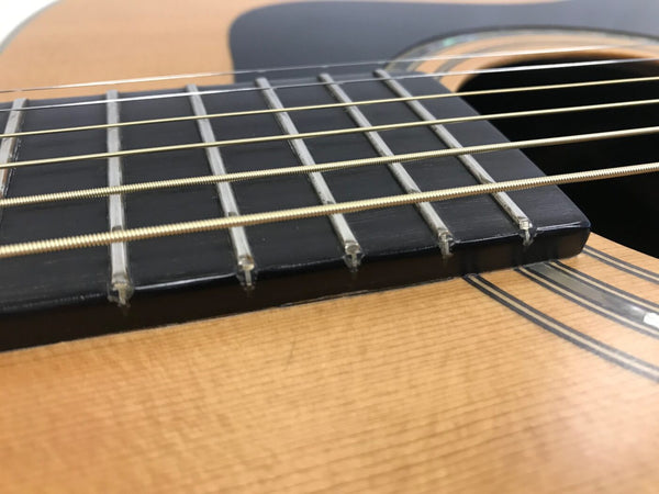 Close-up of acoustic guitar fretboard and steel strings on natural wood body with rosette design, detailed view for Coffee House Guitars product listing