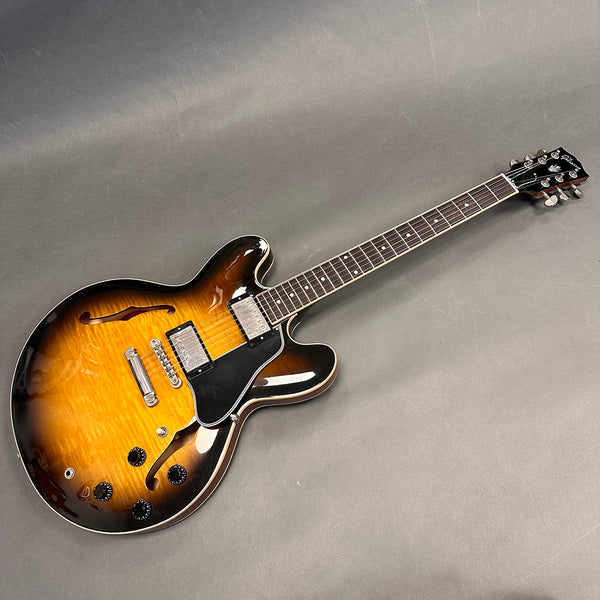 Gibson ES-335 electric guitar with sunburst finish, maple top, dual humbucker pickups, semi-hollow body, and rosewood fretboard.