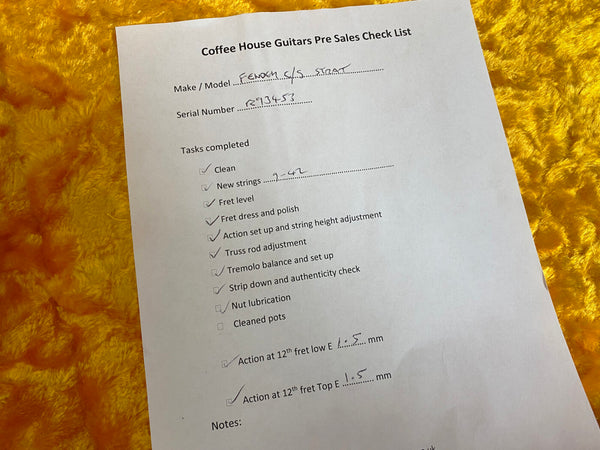 Coffee House Guitars pre sales checklist for Fender S/S Strat guitar with serial number R93453, showing completed setup tasks including cleaning, new 7-42 gauge strings, fret leveling, fret dress and polish, action set up, truss rod adjustment, tremolo balance, strip down and authenticity check, with action measurements at 12th fret low E and top E strings.