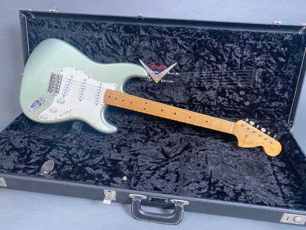 Fender Custom Shop Limited Edition electric guitar in seafoam green with maple neck and white pickguard inside black plush-lined hard case