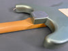 Close-up of vintage electric guitar neck joint with metallic green body and maple neck showing wear and wood grain at Coffee House Guitars product listing