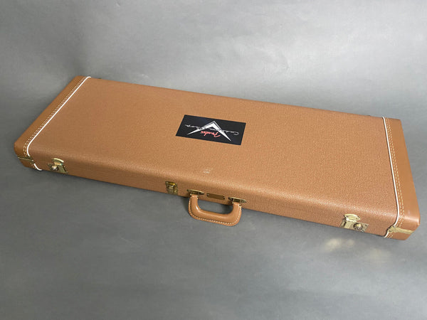 Brown vintage-style hard guitar case with white stitching and gold latches featuring a Fender Custom Shop logo on the lid