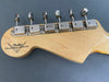 Fender Custom Shop maple guitar headstock with vintage-style chrome tuning machines on gray background