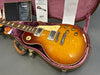 1999 Gibson Les Paul Standard electric guitar with sunburst finish and flame maple top in open hardshell case with Gibson Gold Warranty and authenticity certificates from Coffee House Guitars