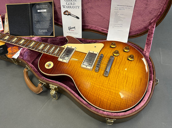 1999 Gibson Les Paul Standard electric guitar with sunburst finish and flame maple top in open hardshell case with Gibson Gold Warranty and authenticity certificates from Coffee House Guitars