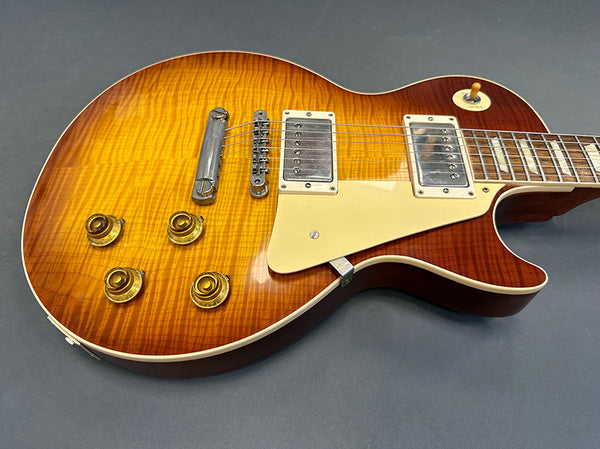 Sunburst finish electric guitar with dual humbucker pickups and four control knobs on gray background, coffee house guitars product listing