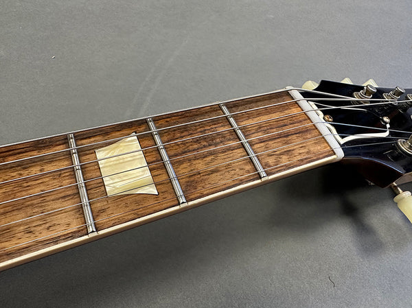 Close-up of guitar neck and fretboard with rectangular mother-of-pearl inlay and metal frets on a Coffee House Guitars electric guitar