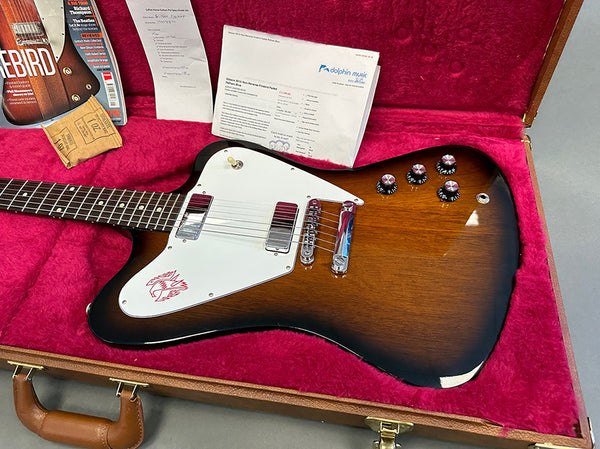 Vintage sunburst Gibson Firebird electric guitar with white pickguard and chrome hardware in red plush-lined hardshell case with original papers and accessories