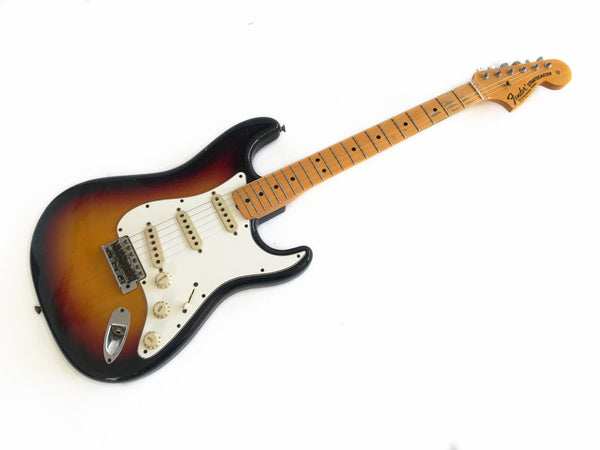 Fender Stratocaster electric guitar with sunburst finish, maple neck, and three single-coil pickups, shown on white background