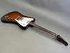 Electric guitar with sunburst finish and white pickguard featuring dual humbucker pickups and chrome hardware, displayed on grey background at Coffee House Guitars.