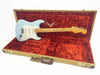 Fender Custom Shop Stratocaster electric guitar in sonic blue finish with maple neck and vintage-style hardware inside a tweed hard case with red plush interior lining.