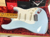 Fender Custom Shop light blue electric guitar with maple neck and white pickguard in red velvet-lined guitar case with Fender Custom Shop paperwork