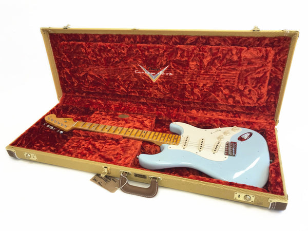 Fender Custom Shop electric guitar in sonic blue finish with maple neck in vintage brown tweed hard case with plush red interior lining