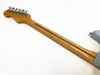 Maple neck with skunk stripe on electric guitar, vintage style tuning pegs and light wood finish detail against white background