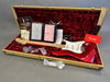 Fender Custom Shop 2019 red electric guitar with maple neck and white pickguard in tweed hard case with certificates, warranty card, and accessories on red velvet interior