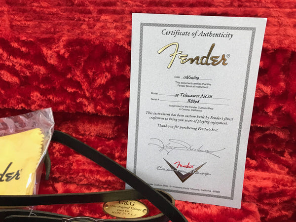 Fender Custom Shop Certificate of Authenticity for 55 Telecaster NOS guitar with serial number R8808 on red plush guitar case lining with G&G vintage guitar strap and Fender polishing cloth